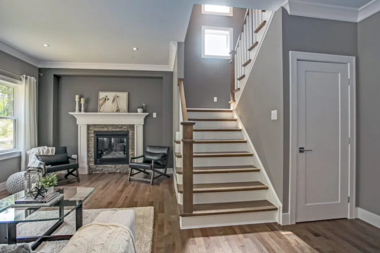 curved staircase with hammered spoon metal balusters